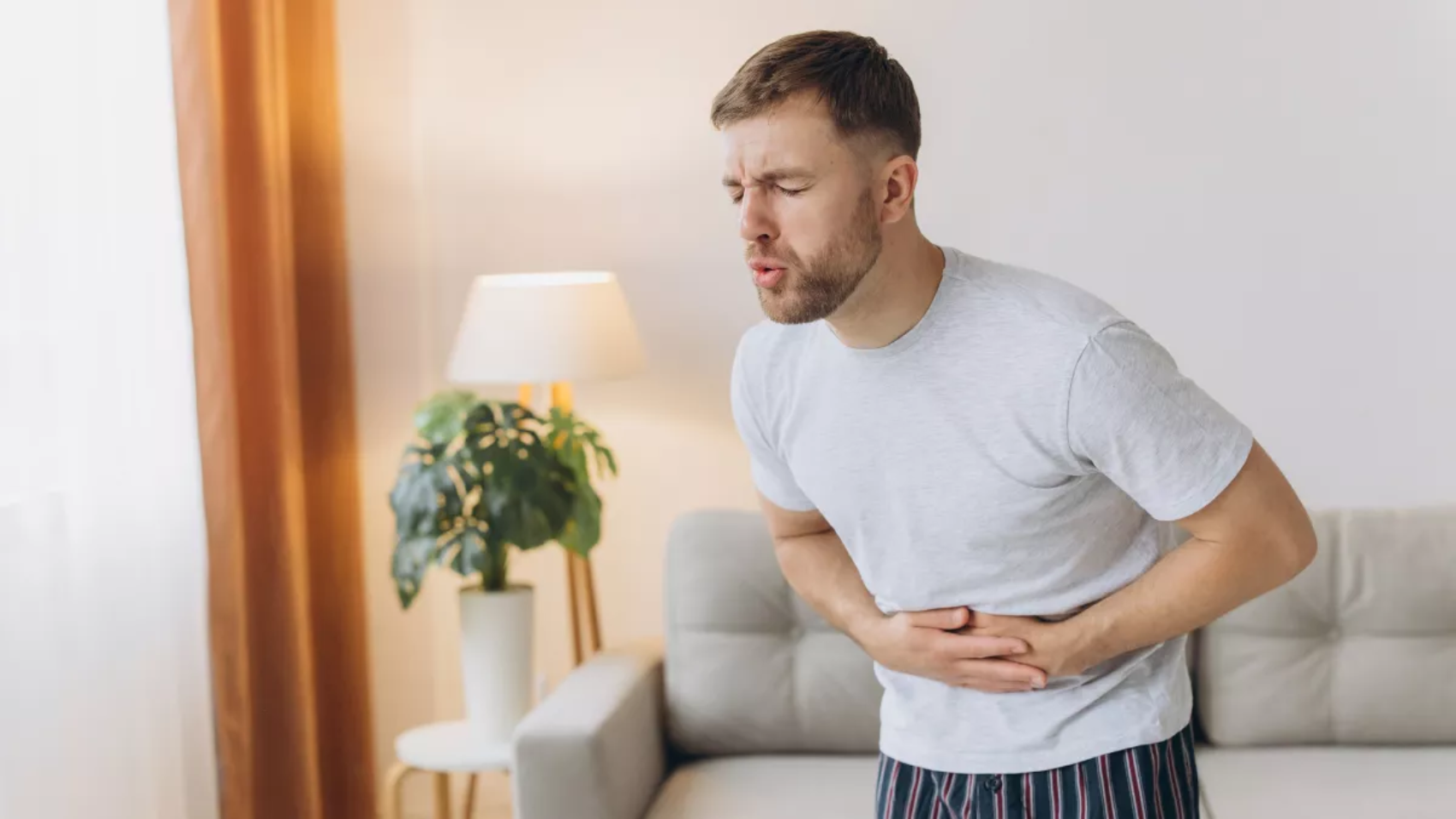 man_stomach_pain_ache_2476476509