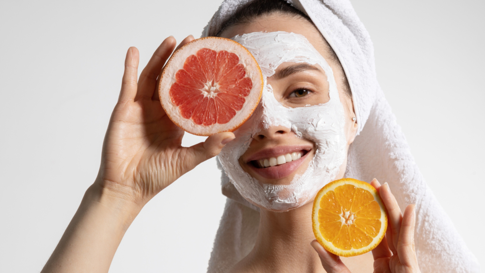 Smiling,Pretty,Young,Woman,In,Towel,With,Natural,Mask,On