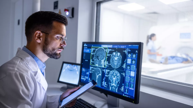 man-examining-xray_shutterstock_2384965203